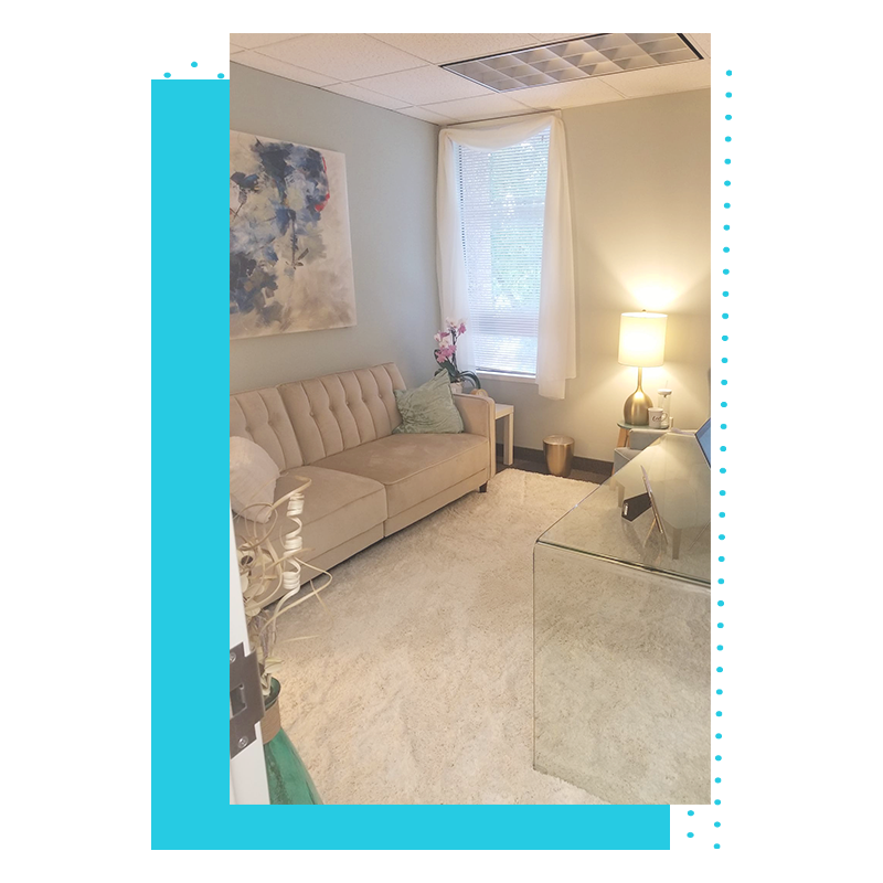 Comfortable, calming therapy room at CoVa with a couch and soft lighting
